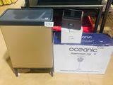 a box of coffee cups on the floor next to a box of coffee cups