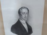 portrait of a man in a suit and tie in a gold frame