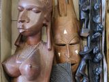 a box with a variety of african masks in it