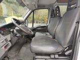the interior of a truck with a steering wheel and a dashboard