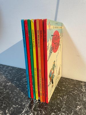 five children ' s books sitting on a table