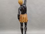 an image of a statue of a woman holding a basket of flowers