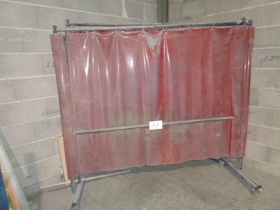 a picture of a room that has a red curtain on the wall