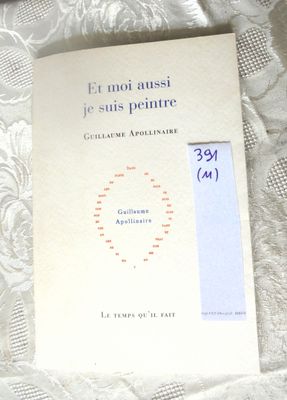 a book that is sitting on a bed with a white sheet