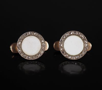 a pair of white jade and diamond cufflinks