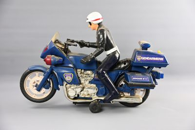a figurine of a police officer riding a motorcycle