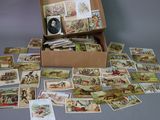 a box full of cards with pictures of people on them