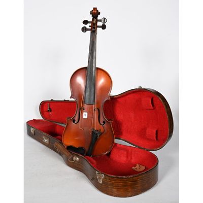 an old violin sits in a case on a white background