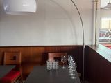 a table with wine glasses on it in a restaurant