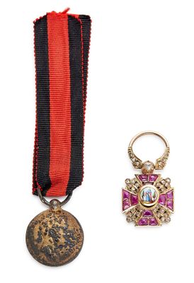 une image représentant une médaille et une épingle à médaille sur fond blanc