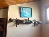 a picture of a room with a wooden ceiling and a picture on the wall