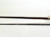 pair of antique swords on a white surface with a white background