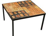an image of a table made out of wood and tile