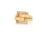 a yellow gold ring with diamonds on a white background