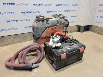 a dust collector and a vacuum on the floor