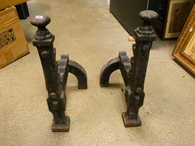 pair of antique cast iron iron door handles on display in a store
