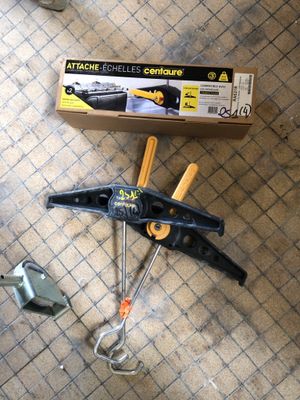 a box of tools sitting on the floor next to a pair of scissors