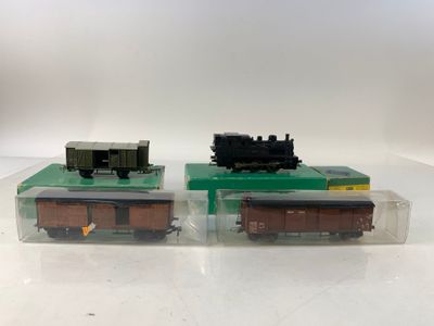 two toy trains sitting side by side on a table