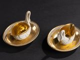 pair of gold plated swan dishes with spoons and saucer