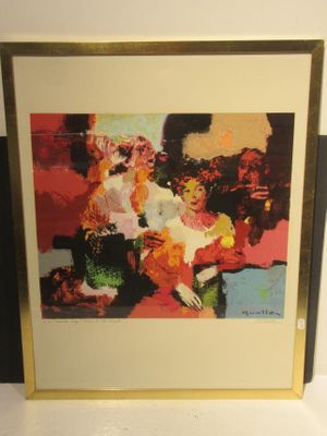 painting on the wall of a room with a picture of a woman sitting on a chair