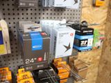 many different types of electronics on display in a store