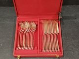 a red case with silverware in it on a table