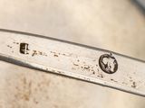 a close up of a metal spoon with a metal handle