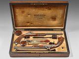 an old wooden case with a variety of tools in it