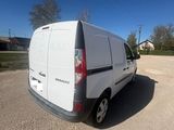 the back of a white van parked in a parking lot