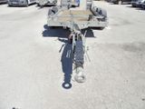 a trailer with a trailer attached to it in a parking lot