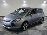 a picture of a silver opel parked in a garage