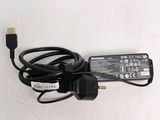a charger that is plugged in to a laptop