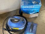 a box of emergency items on the floor next to a vacuum