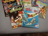 a lot of comic books sitting on a table