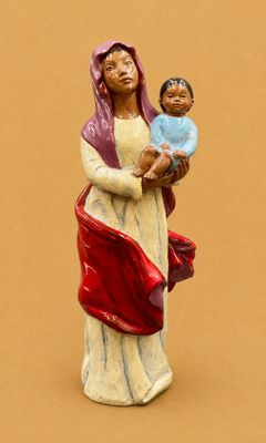 figurine of a woman holding a child in her arms