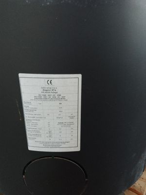 an image of a large black barrel with a price label on it