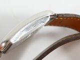 a close up of a person ' s hand holding a watch