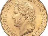 a close up of a gold coin with a woman ' s head on it