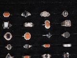a display case with many different rings on it