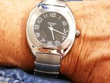 a close up of a person ' s wrist with a watch on it