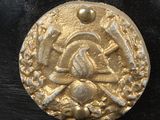 an image of a gold coin on a black surface