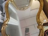 a mirror that is sitting on a table next to a mirror