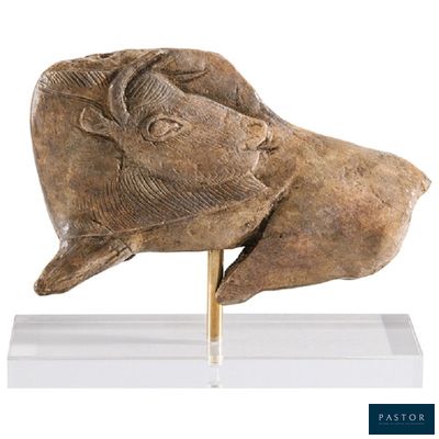 statue of a head of a man with a goat ' s head on a stand
