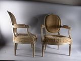 two chairs sitting next to each other on a white background