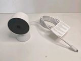 an image of a white camera sitting on top of a white table