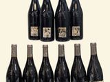 six bottles of red wine are lined up in a row