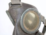 a gas mask with a gas bottle attached to it