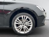 a close up of a car ' s wheel on the ground