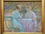 un tableau représentant deux femmes assises à une table