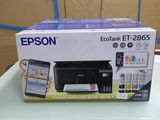 a box with a printer and a cell phone on a table